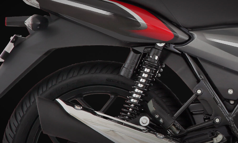 Rear Suspension System of Black and Red Color Bajaj Discover 110cc Motorcycle 